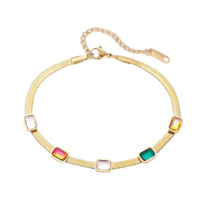 Pulsera dorada con diamantes de diferentes colores